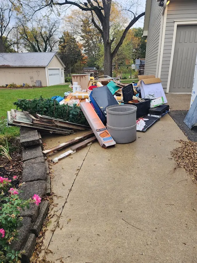 Dumpster being loaded with debris for Roofing Dumpster Rental in Niceville